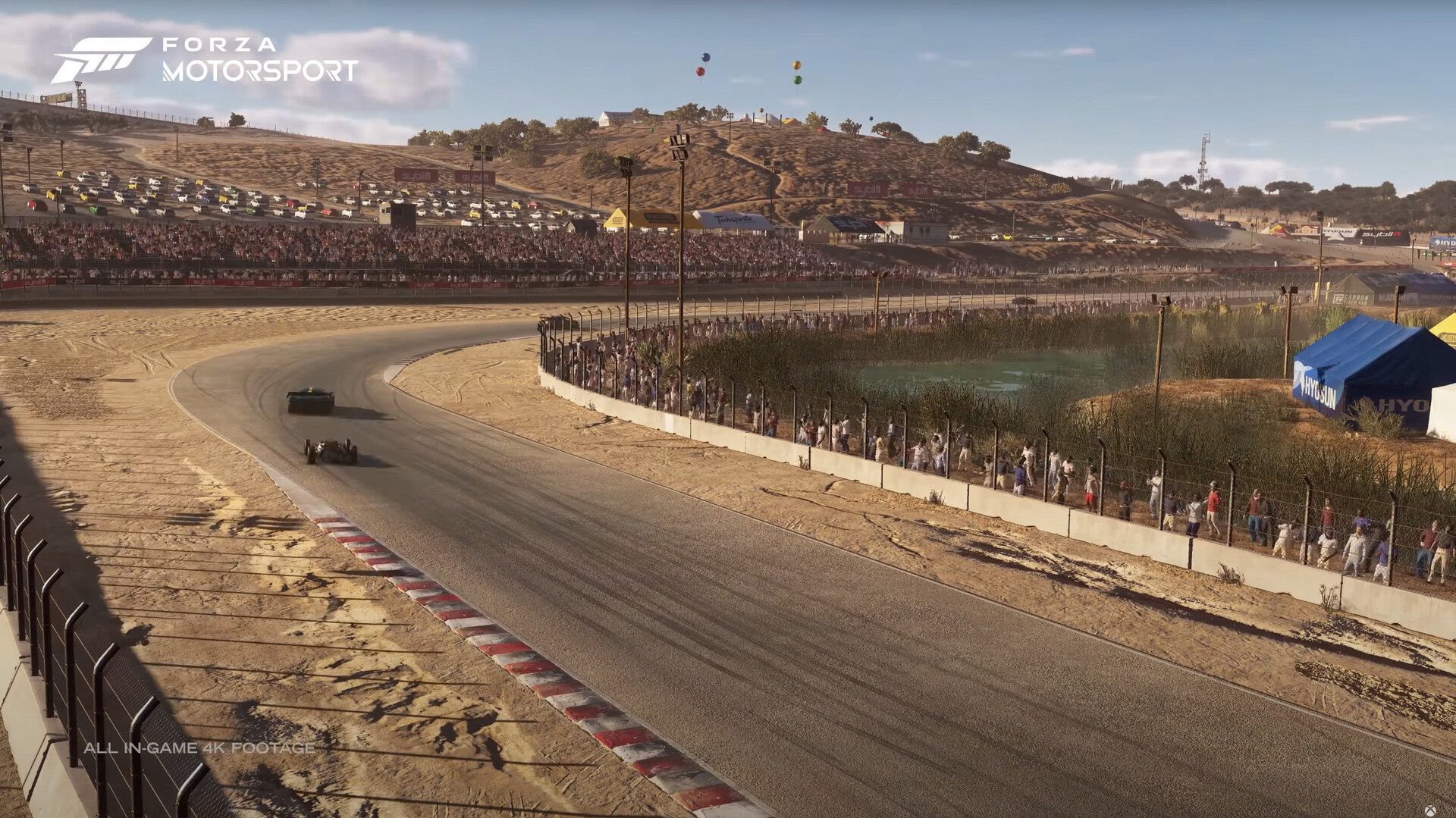 Forza Motorsport - Xbox Showcase 2022: An expanded shot of Laguna Seca. This track was redone for the next generation and this shows the new blends and decals that add an extra la